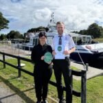 Alison Daun, Managing Director of Jacobite Loch Ness Cruises, and Ranald Fettes, Visitor Experience and Sustainability Manager, with the Gold Green Tourism Award (Credit: Jacobite Loch Ness Cruises)