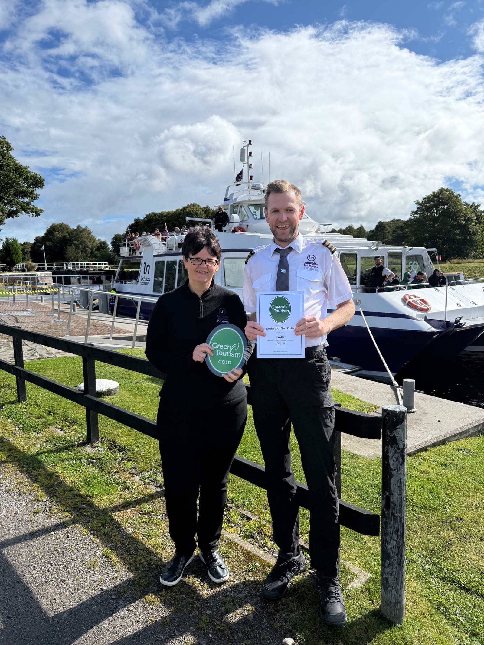 Alison Daun, Managing Director of Jacobite Loch Ness Cruises, and Ranald Fettes, Visitor Experience and Sustainability Manager, with the Gold Green Tourism Award (Credit: Jacobite Loch Ness Cruises)